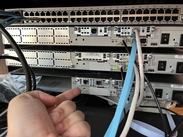 Back of the Cisco 2600 routers showing T1 WAN interface cards and cabling